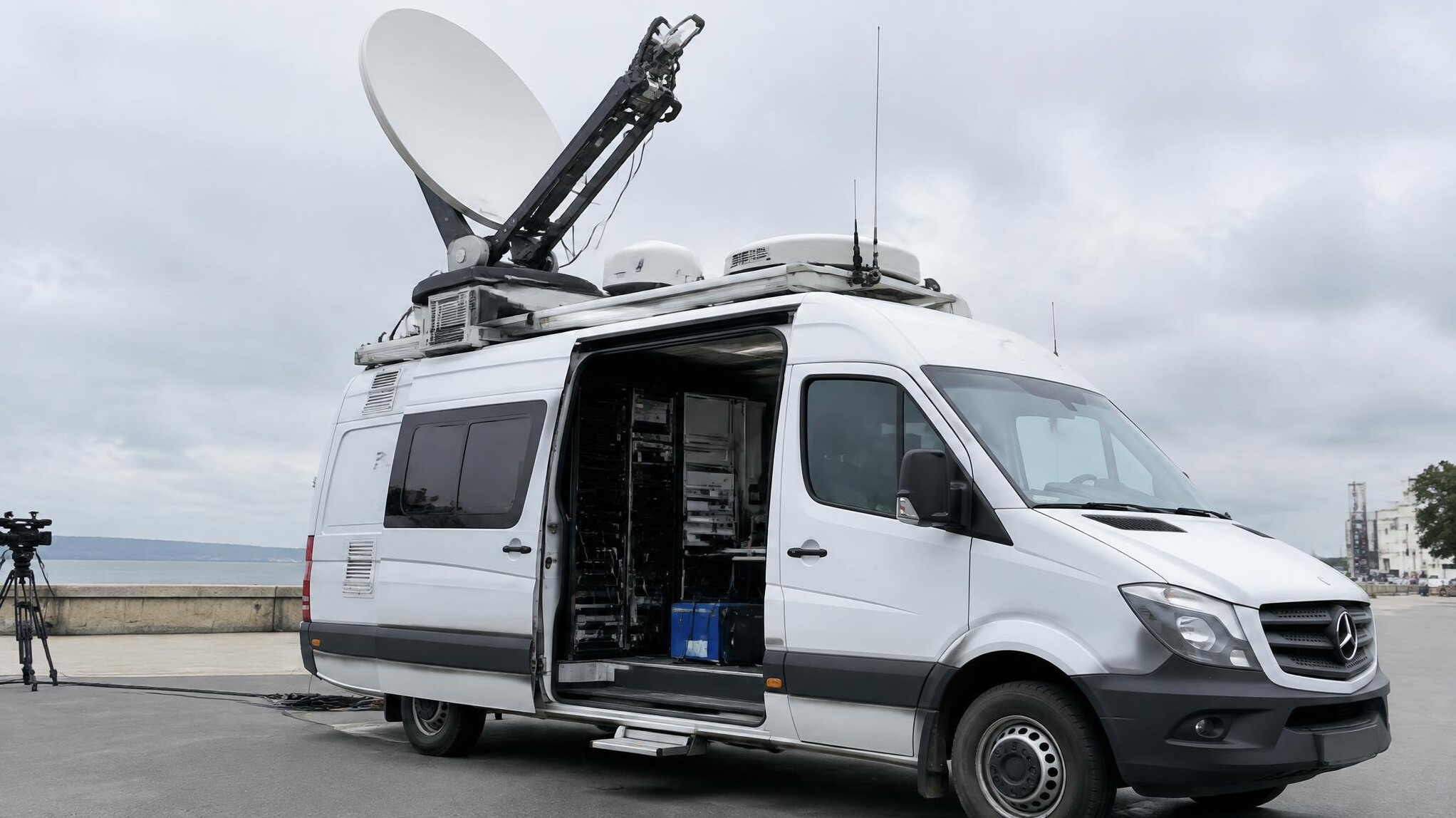 Outside broadcast van with a satellite uplink dish extended